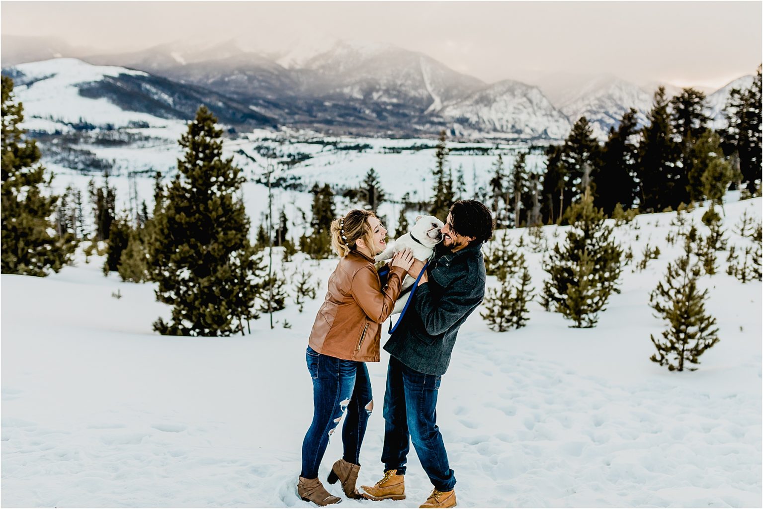 beautiful couple with dog in the mountains of Breckenridge colorado