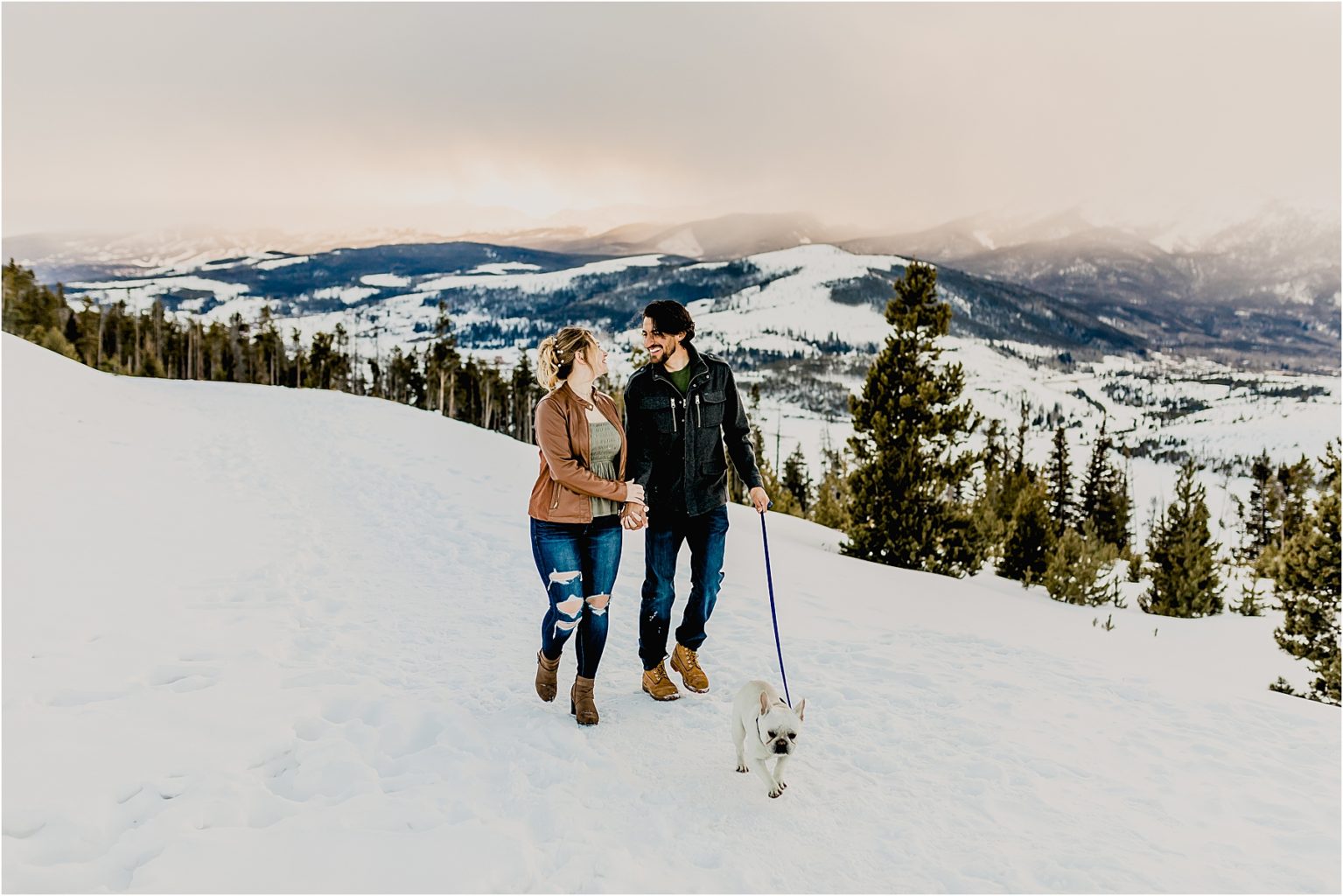 beautiful couple with dog in the mountains of Breckenridge colorado