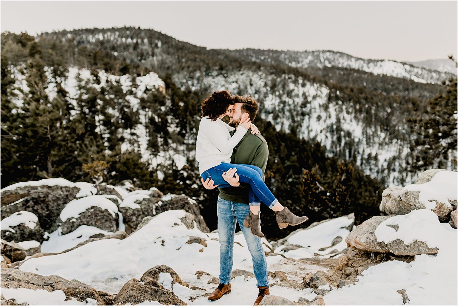 beautiful colorado engagement session in the snow covered trees and mountains