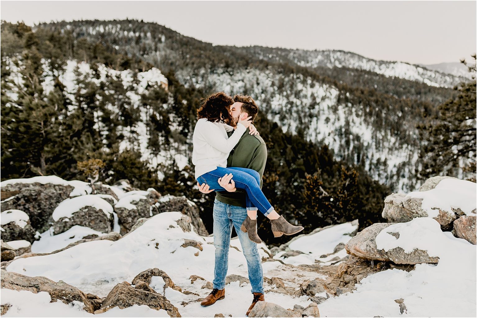 beautiful colorado engagement session in the snow covered trees and mountains