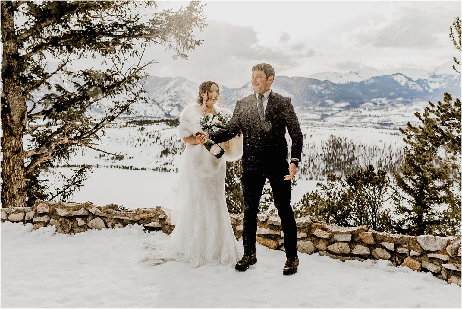 couple popping champagne for adventure elopement