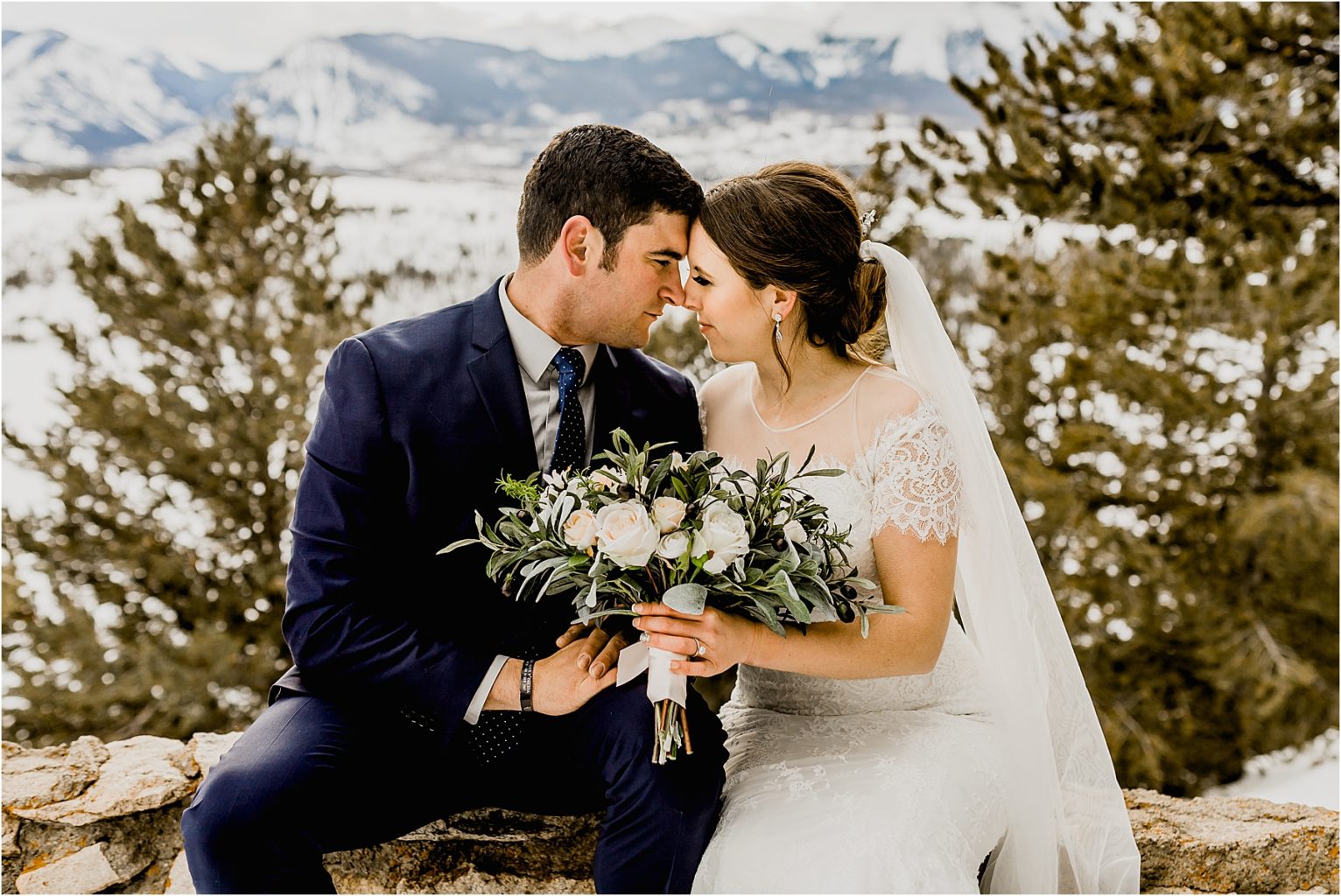 bride and groom with floral bouquet in colorado