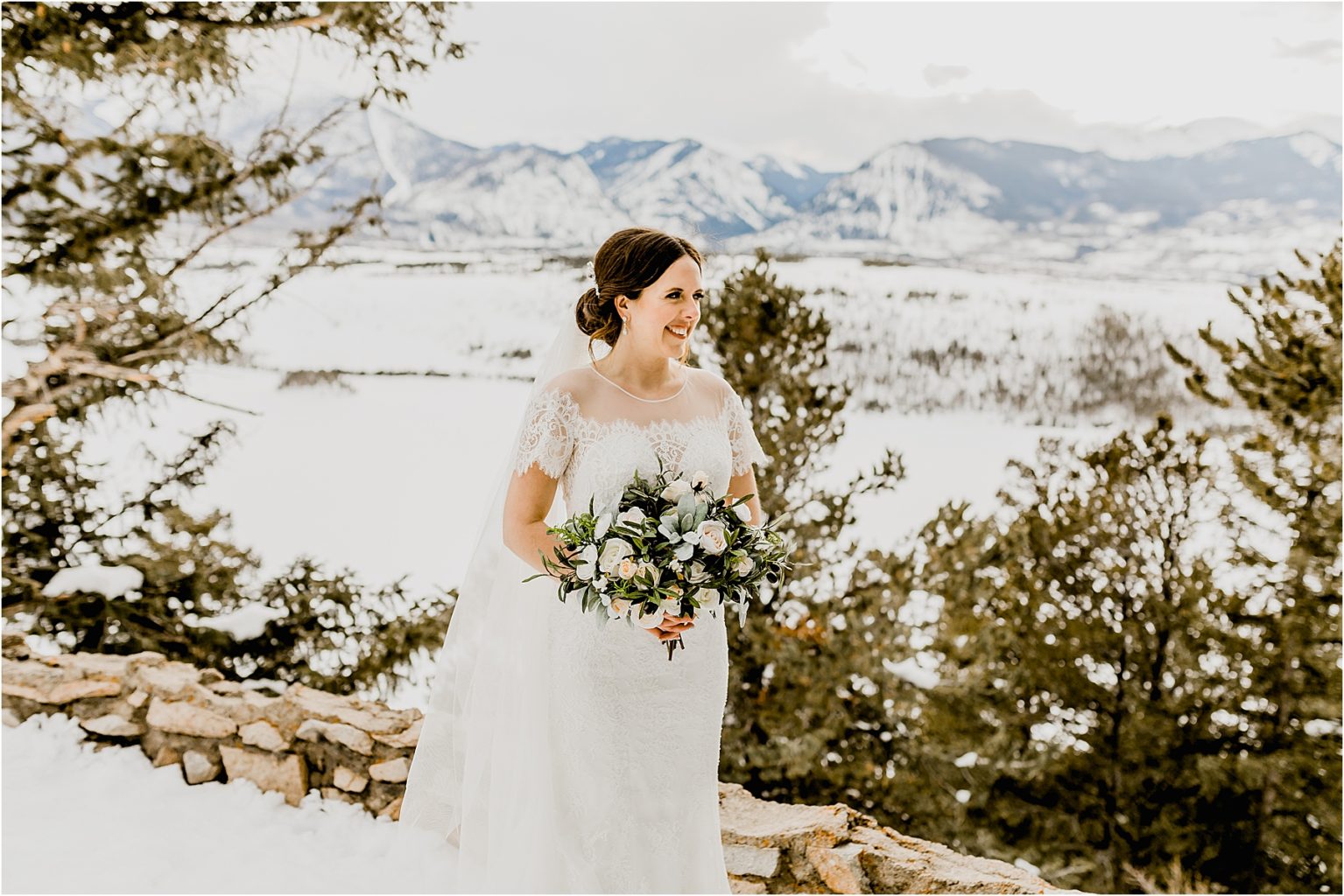 beautiful bride with a bouquet at sapphire point overlook