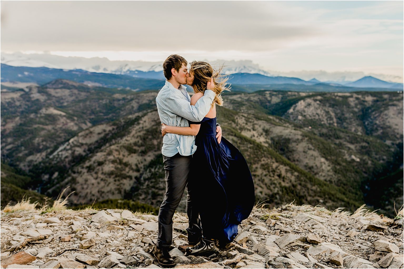 engaged couple in boulder Colorado mountains with beautiful mountain backdrop