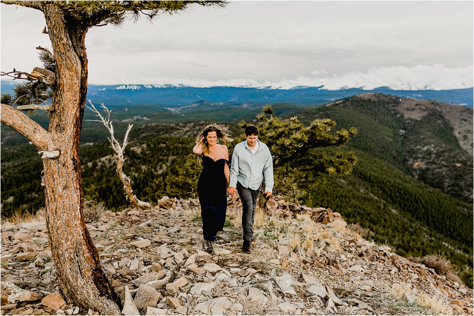 couple hiking for their engagement session in Boulder Colorado