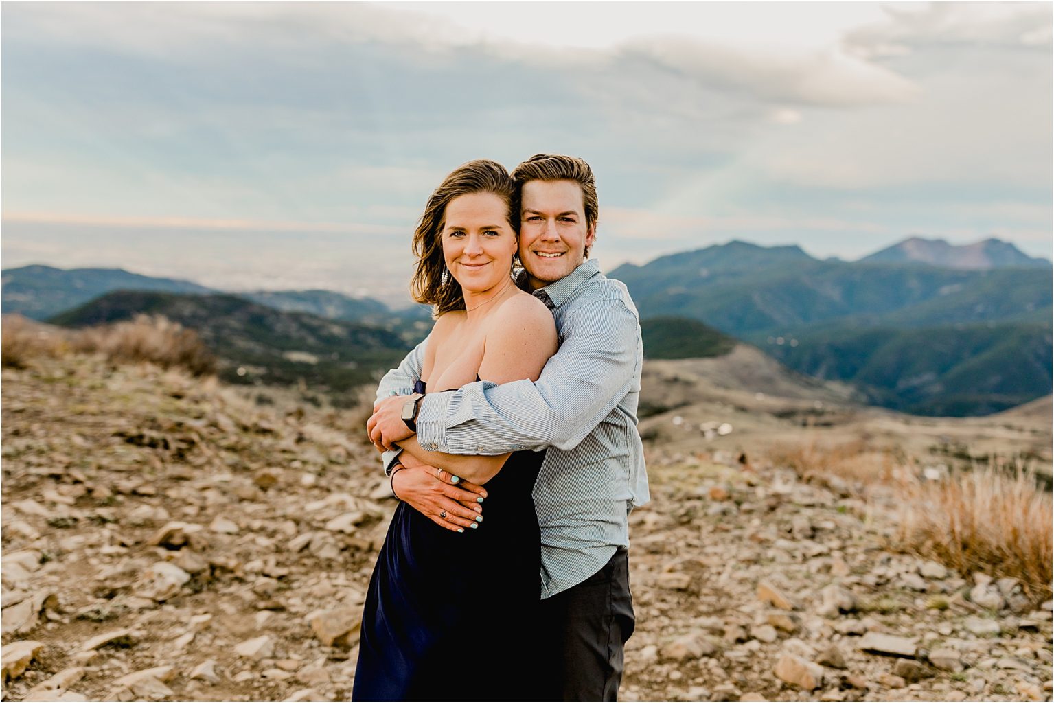 couple embracing for their Colorado engagement photos in boulder mountains