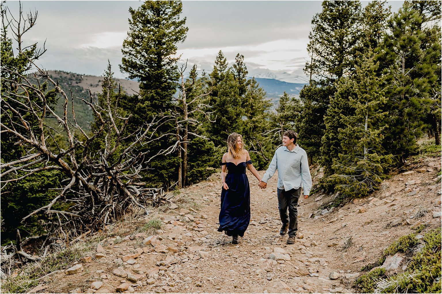 couple hiking for their engagement session in Boulder Colorado