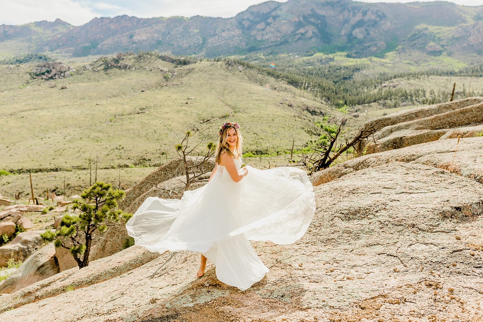 bride twirling in wedding dress for Colorado elopement