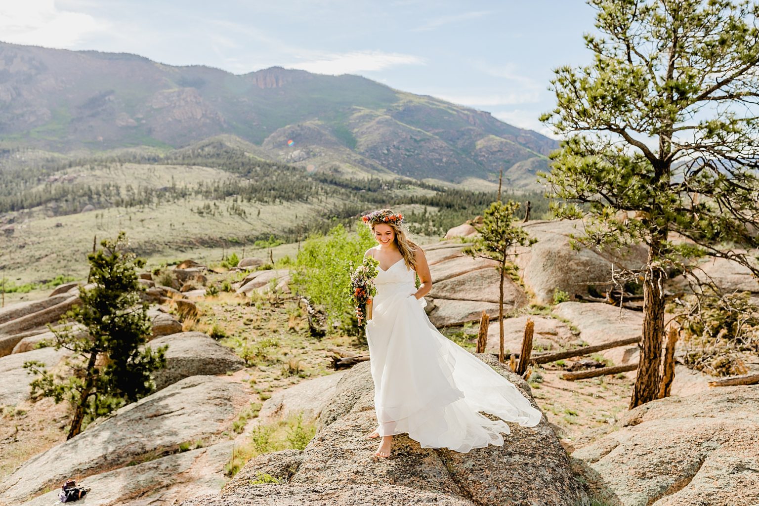 beautiful bride walking in the mountains to ceremony location