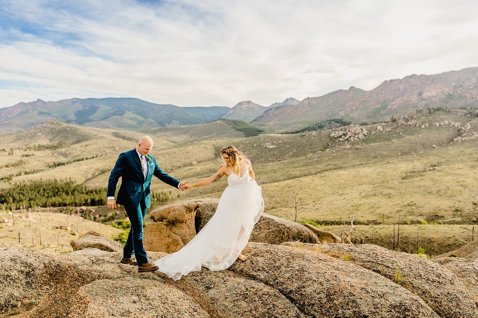 bride and groom walking for elopement in the beautiful mountains of Colorado