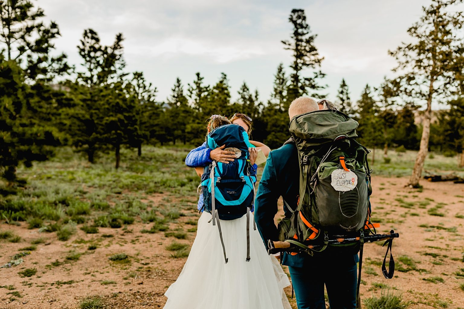 bride hugging family goodbye after adventure elopement