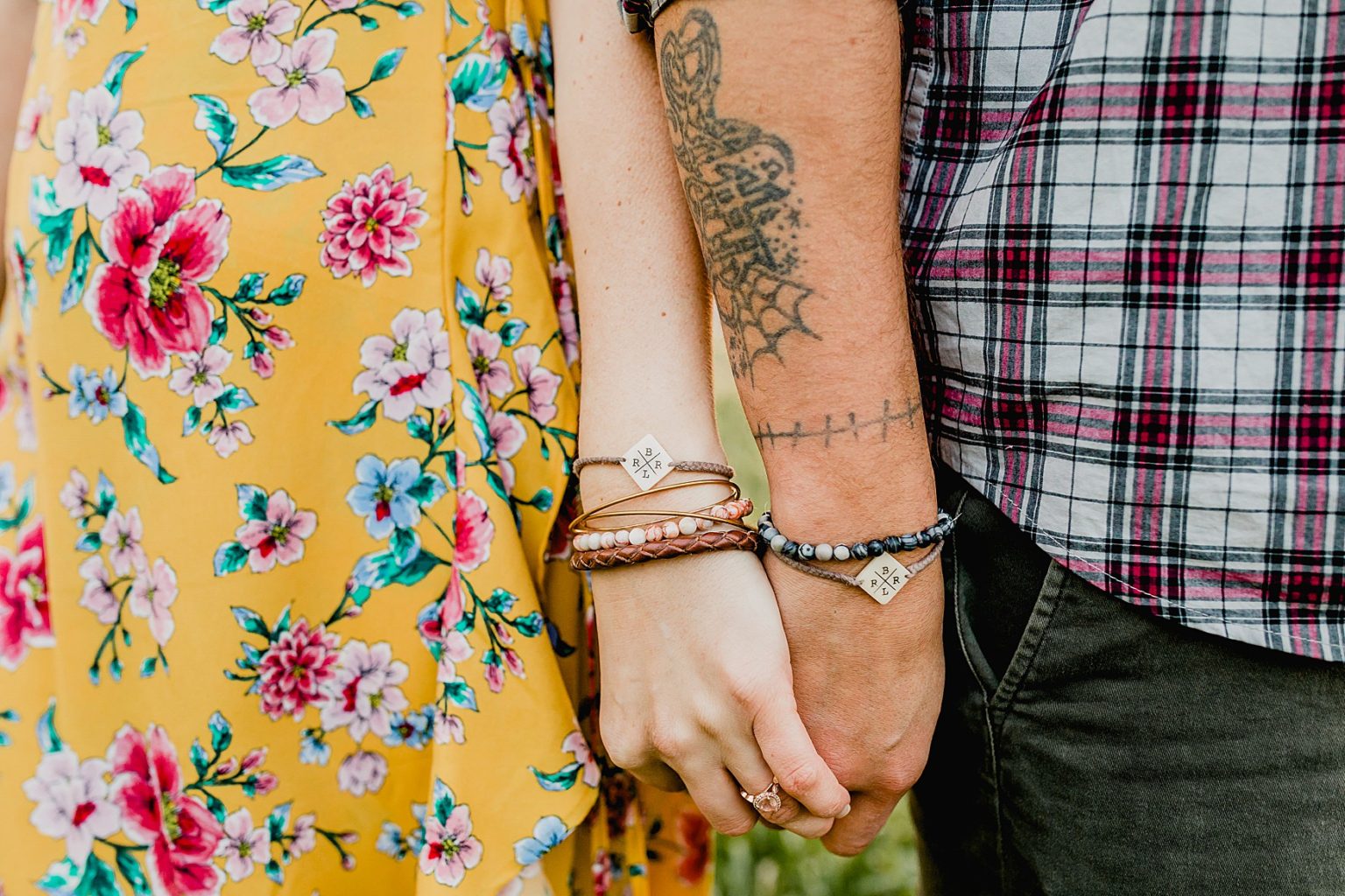 adorable couple in colorado has matching bracelets with initials