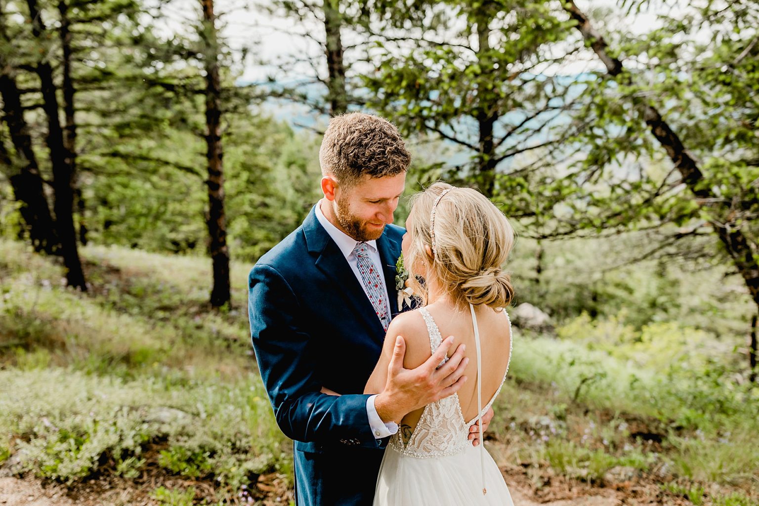 bride and groom are excited for their elopement in the forest and trees of boulder colorado