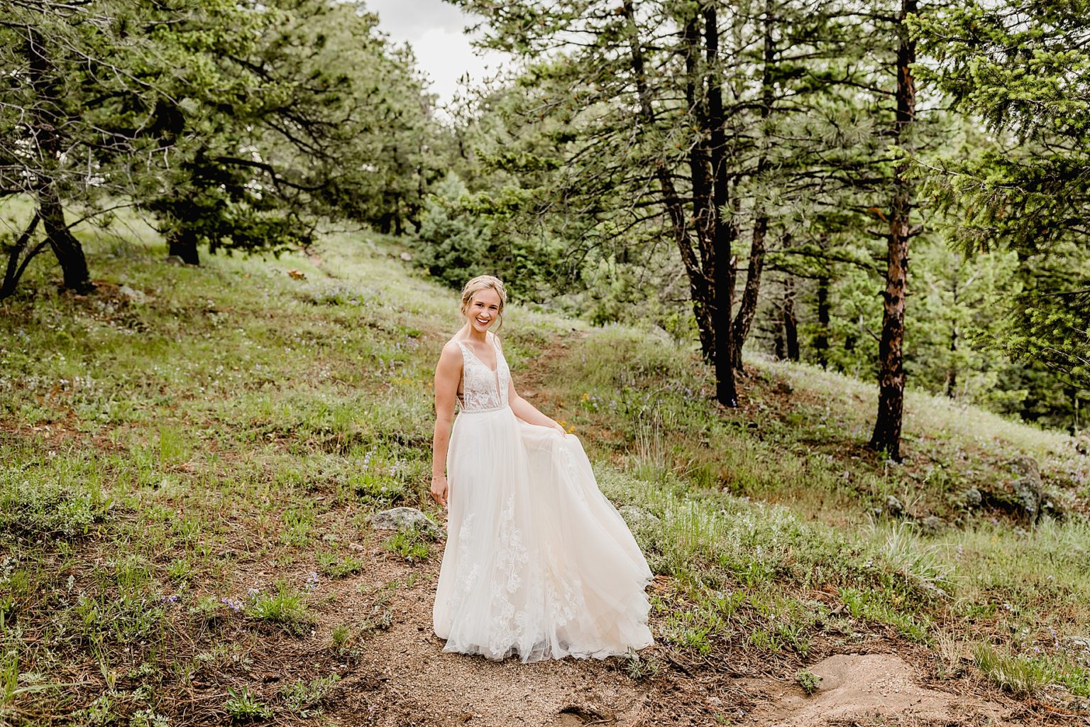 bride twirls in flowy dress before wedding ceremony