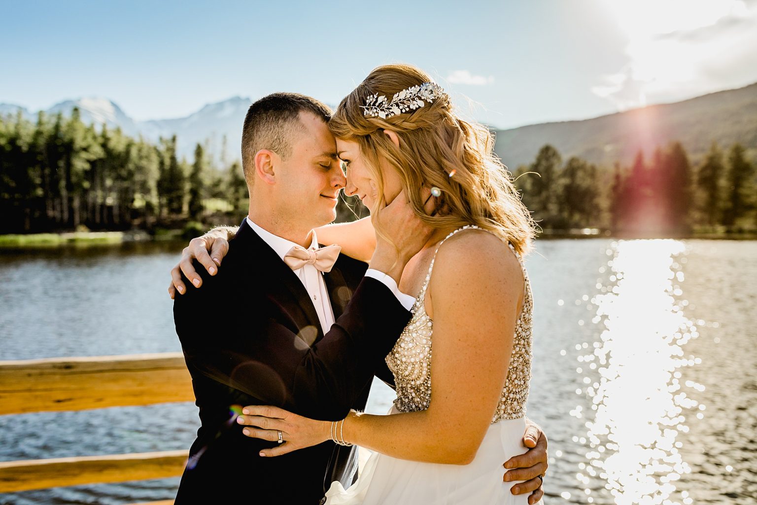 bride and groom embrace after elopement ceremony at in Rocky Mountain national park colorado