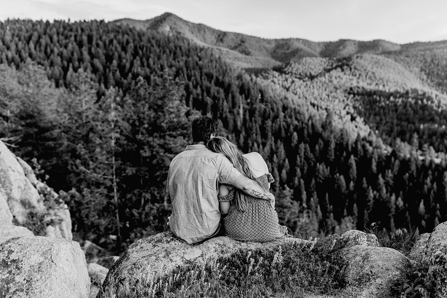 couple looks out at incredible colorado mountain scenery