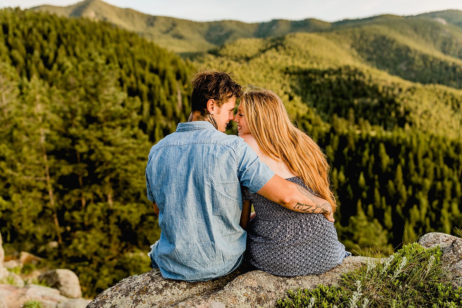 couple looks out at incredible colorado mountain scenery
