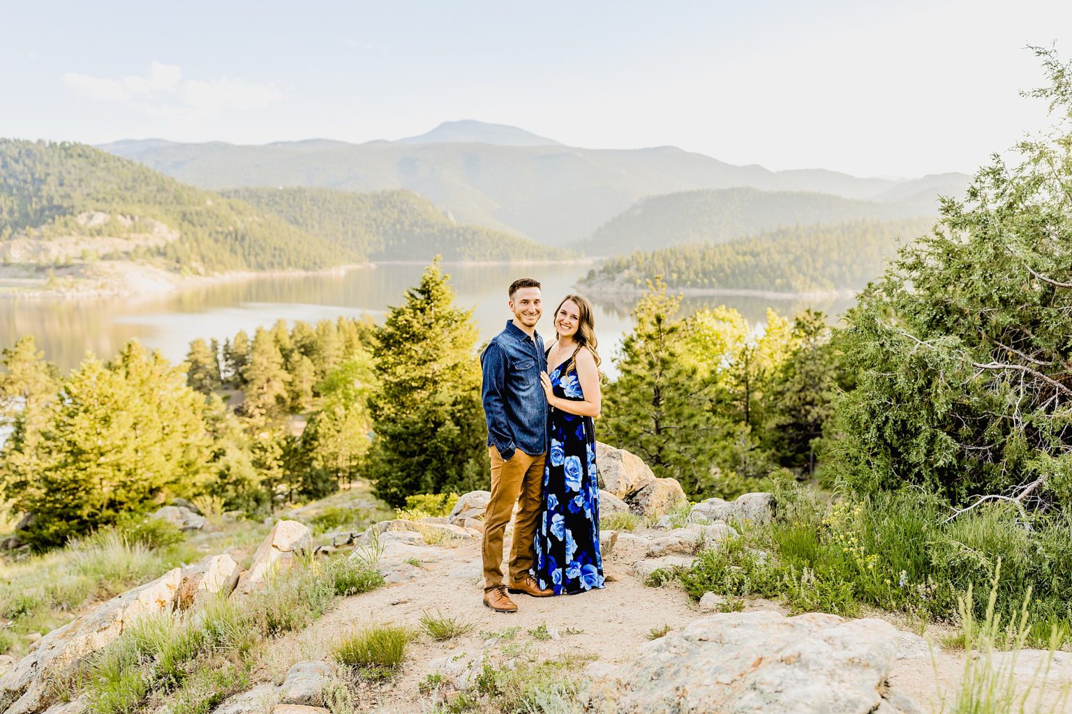 green mountain scenery and lake background with a couple celebrating wedding anniversary