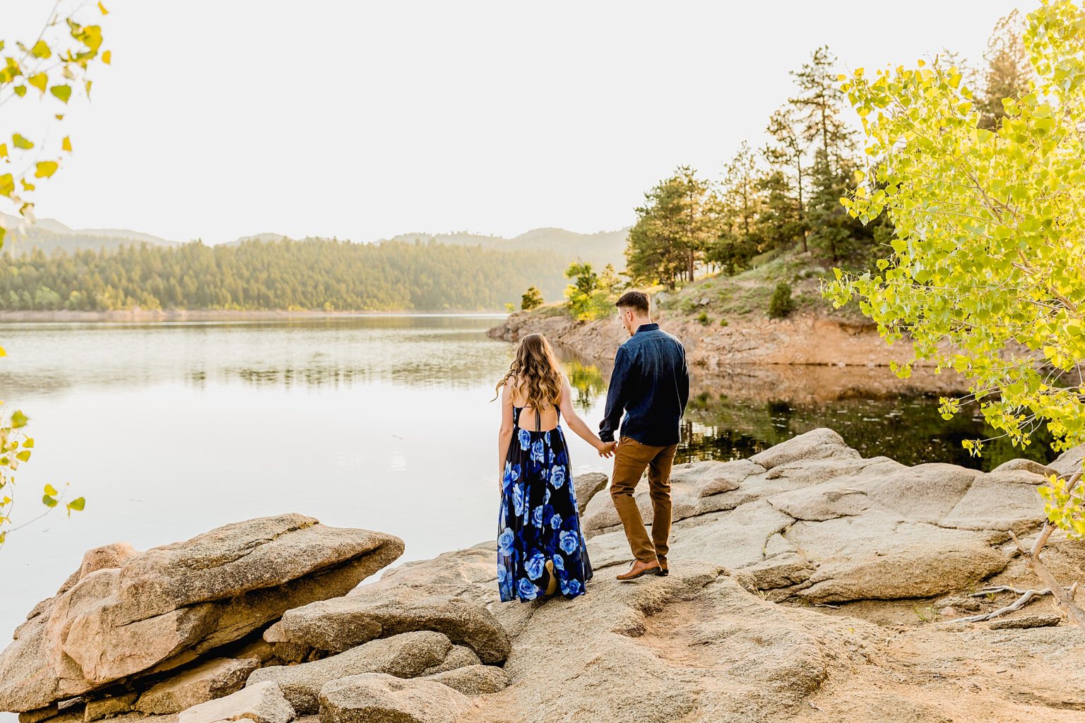 green mountain scenery and lake background with a couple celebrating wedding anniversary