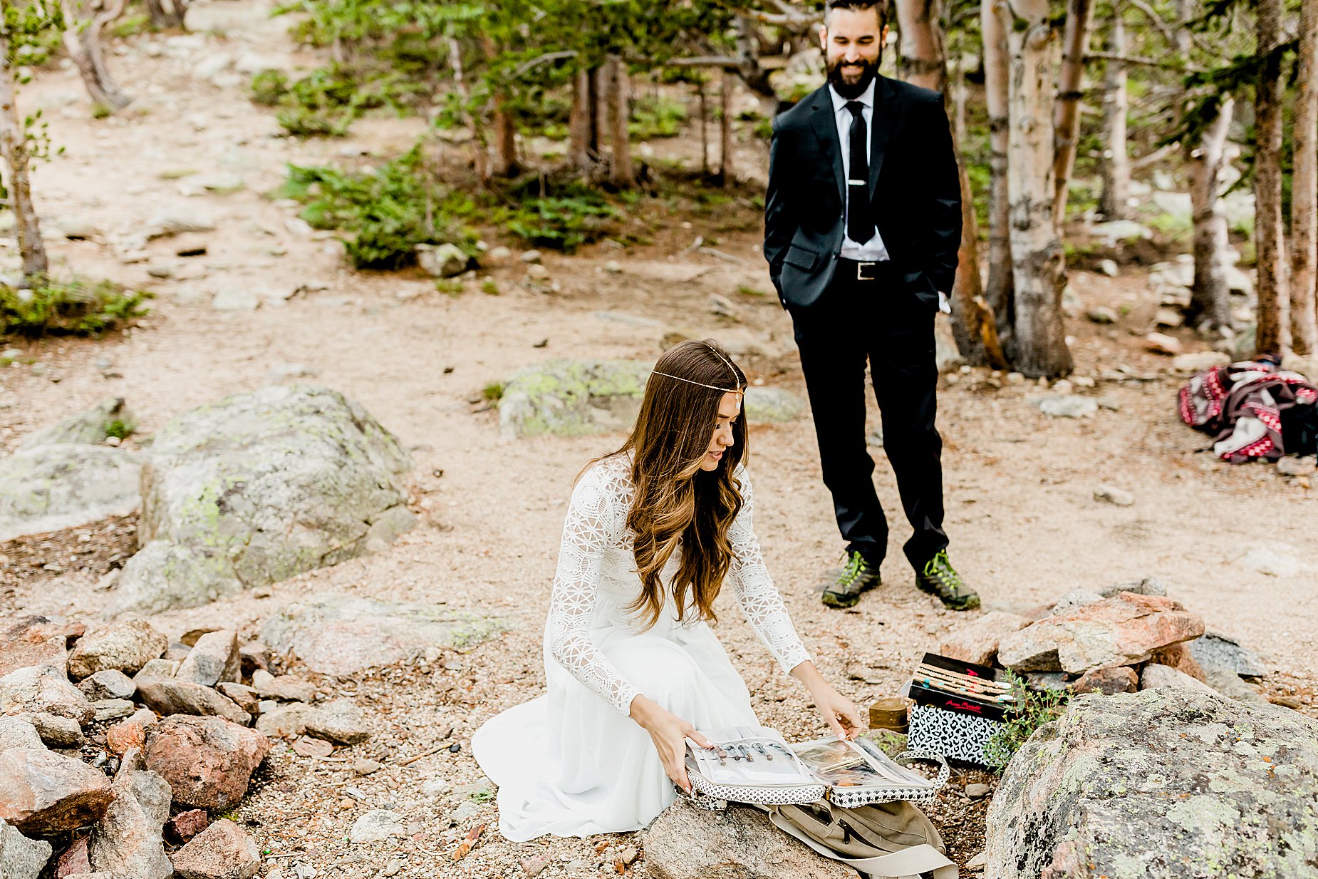 bride is getting ready for outdoor adventure elopement
