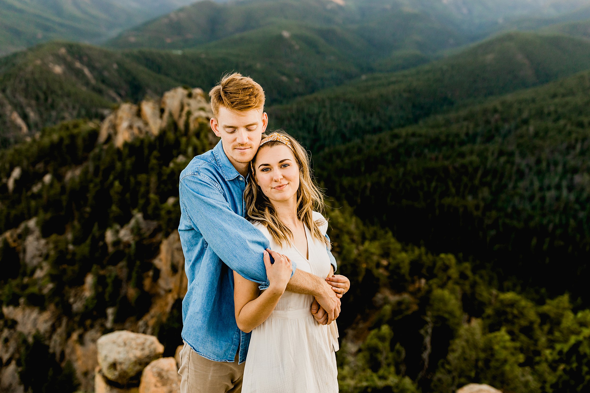 colorado mountain engagement photos, photographer captures couples hiking engagement photos with beautiful colorado mountain scenery in the background