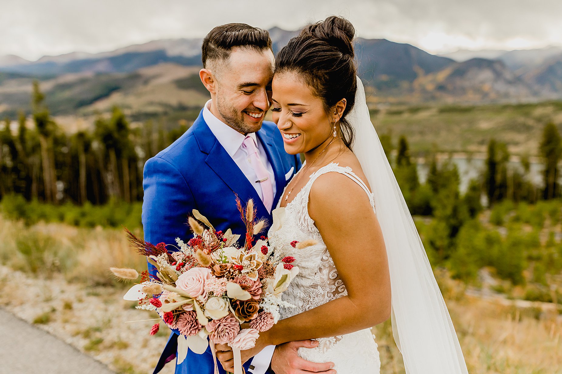 Bride and groom laugh at Sapphire Point for their breckenridge fall elopement with stunning mountain and aspen views, captured by Lauren Casino Photography, a Colorado elopement photographer
