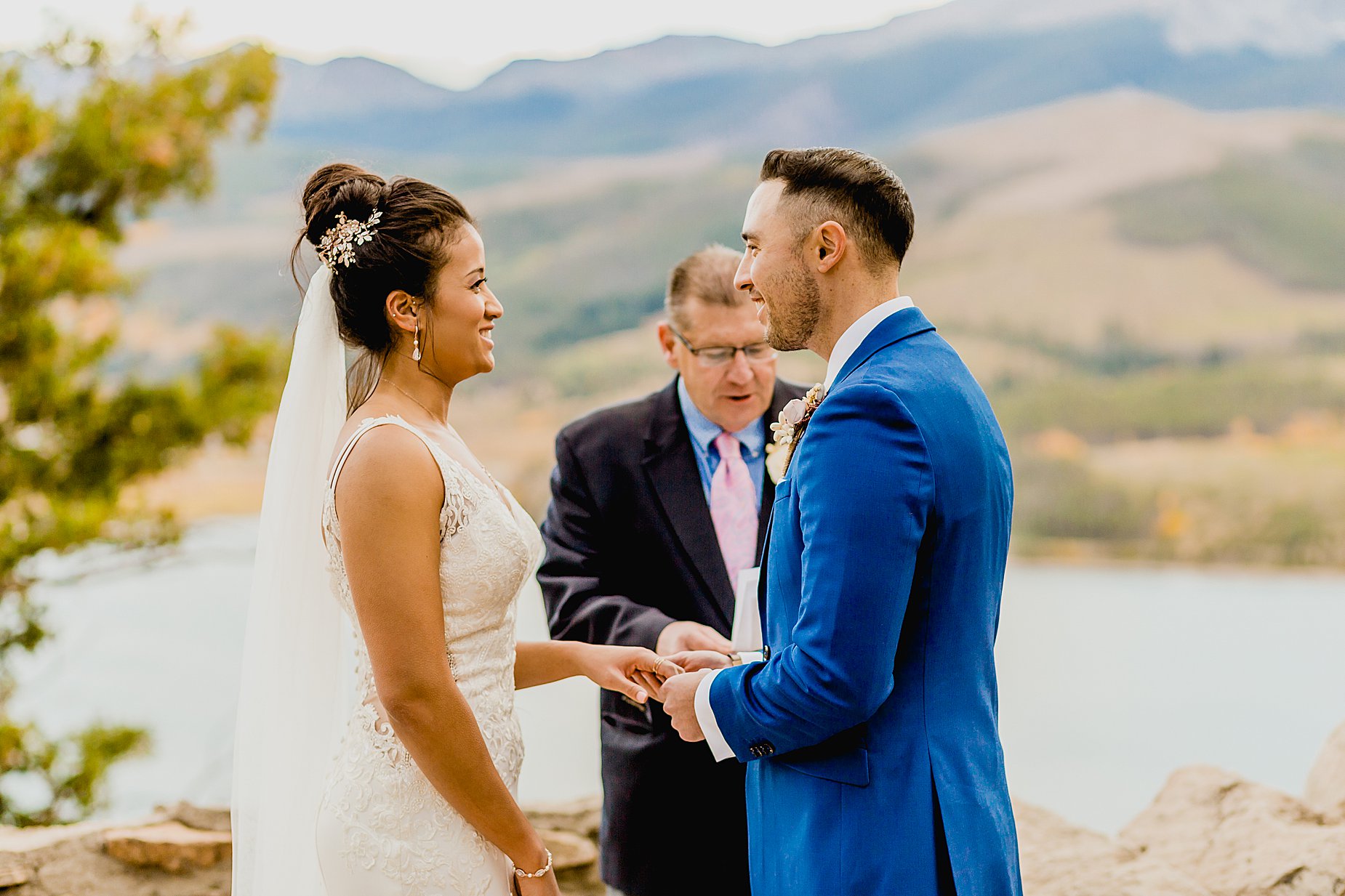 Couple has their breckenridge fall elopement ceremony at Sapphire Point with gorgeous mountain and lake views behind them, captured by Lauren Casino Photography, a Colorado elopement photographer