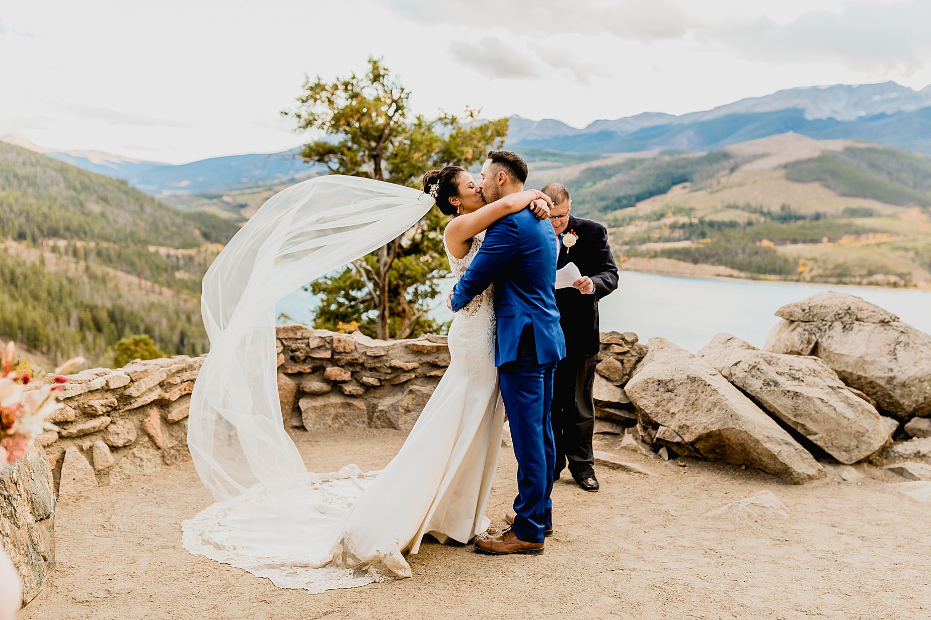 Couple has their breckenridge fall elopement ceremony at Sapphire Point with gorgeous mountain and lake views behind them, captured by Lauren Casino Photography, a Colorado elopement photographer