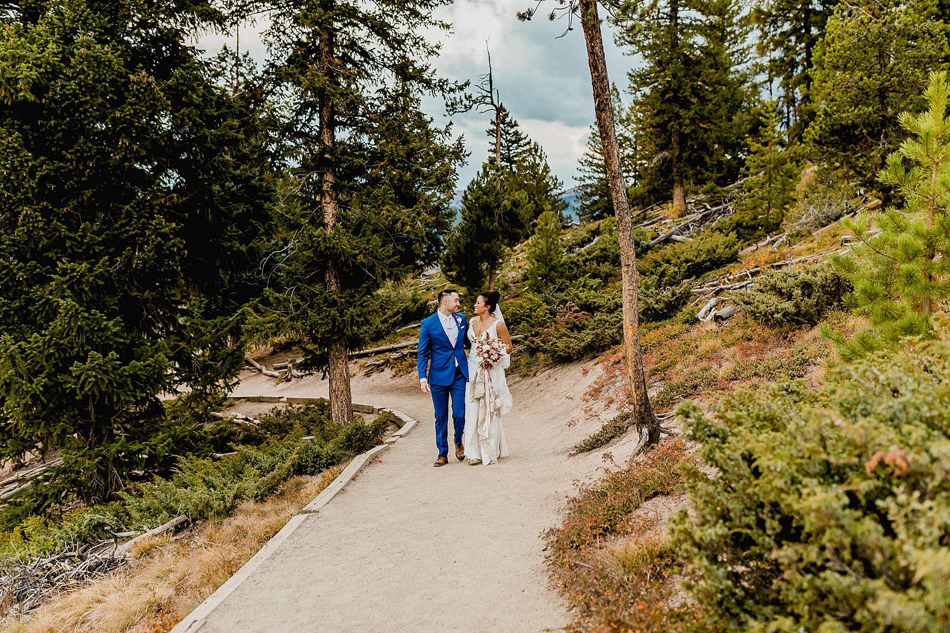 Bride and groom elope in breckenridge colorado with the beautiful mountains and orange aspens in the background, captured by Lauren Casino Photography