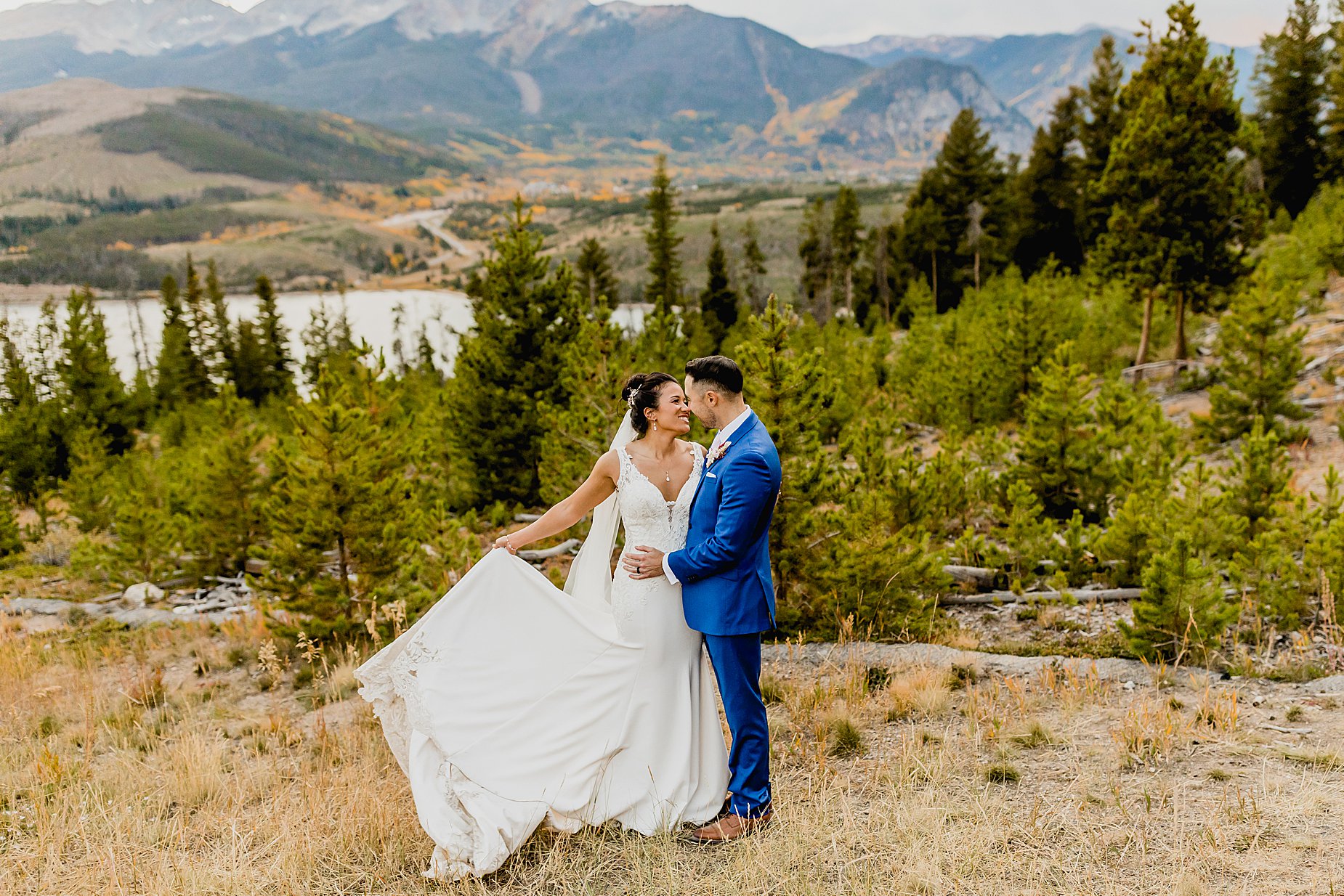 Bride and groom elope in breckenridge colorado with the beautiful mountains and orange aspens in the background, captured by Lauren Casino Photography