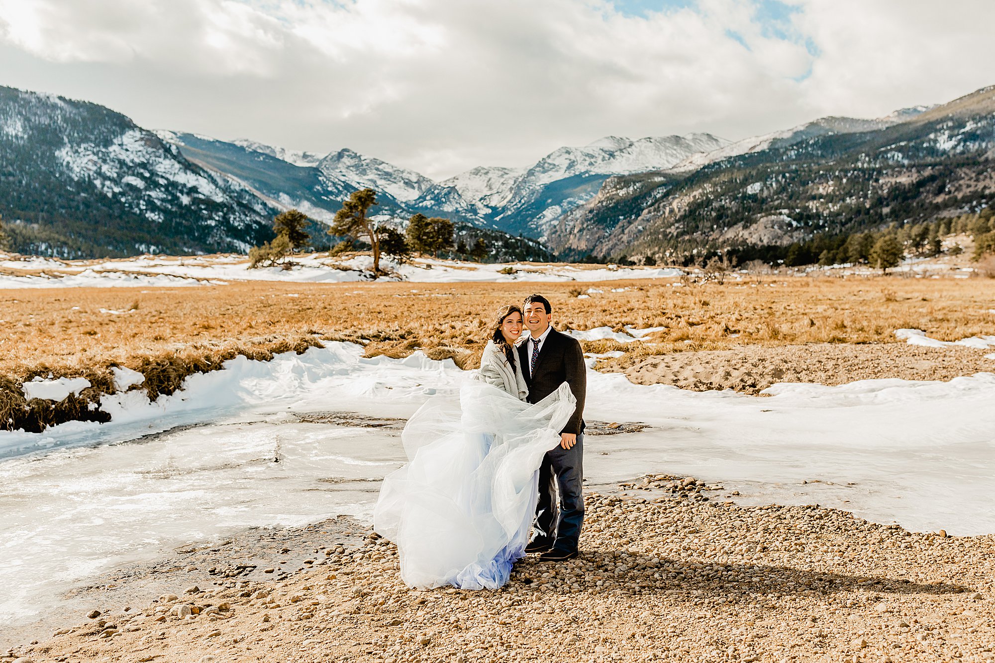 bride and groom explore rocky mountain national park for their winter elopement, photo by lauren casino photography