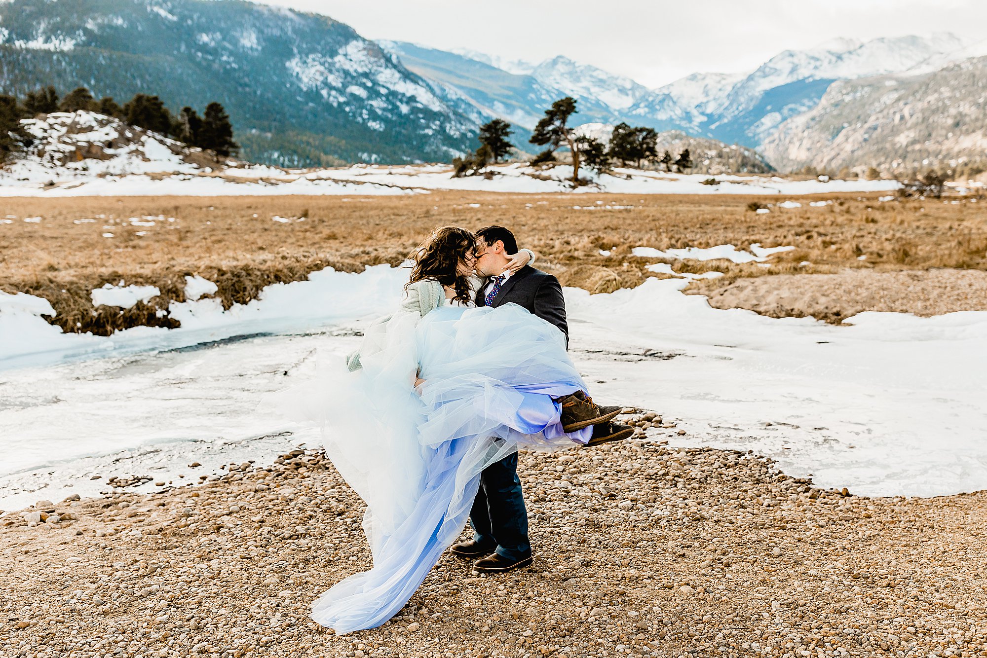 bride and groom explore rocky mountain national park for their winter elopement, photo by lauren casino photography