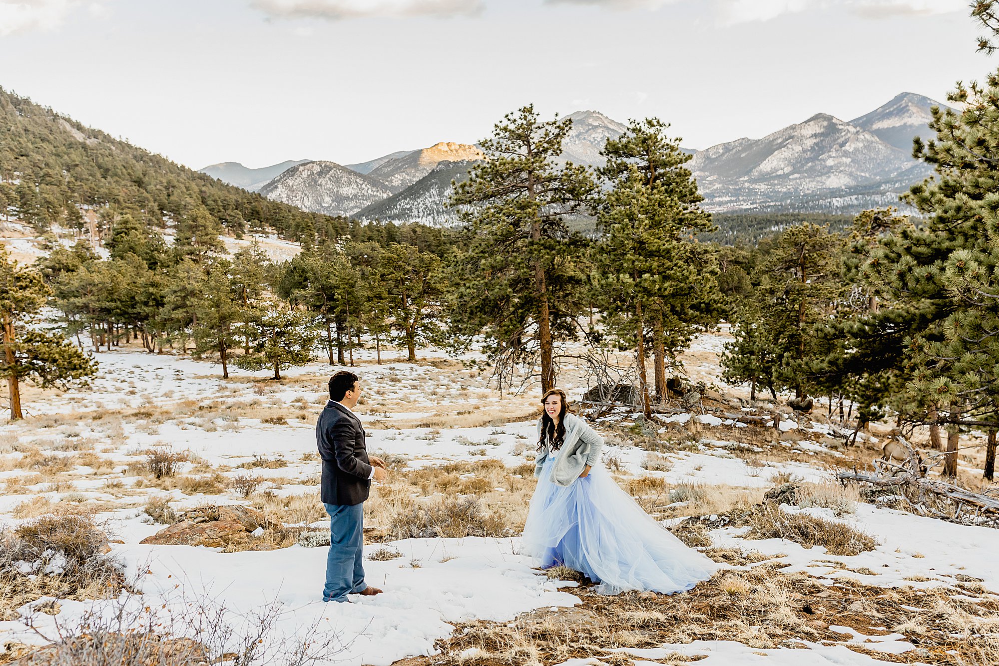 Couple has snowball fight in rocky mountain national park for their winter elopement