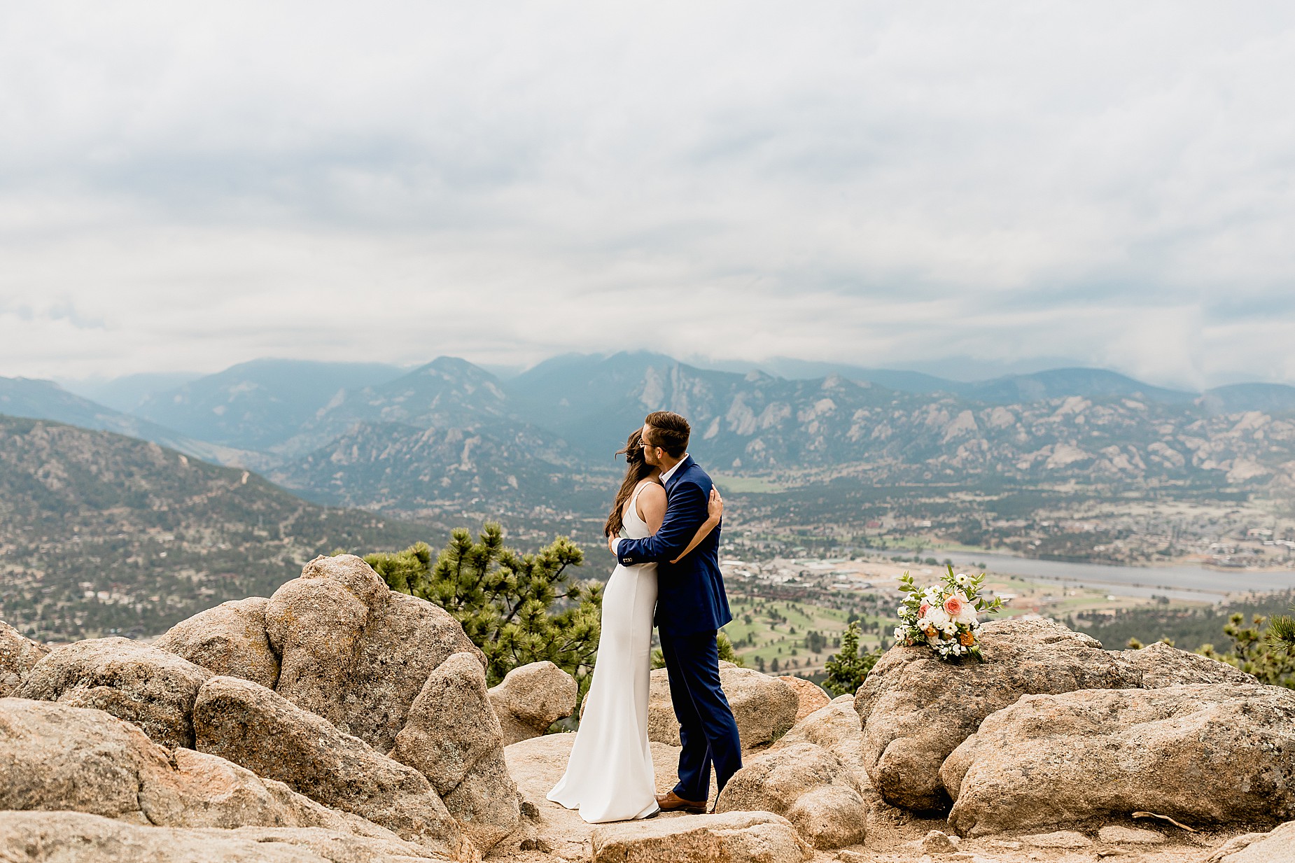 Bride and groom share vows with gorgeous Rocky Mountain views in the background for their Colorado hiking elopement