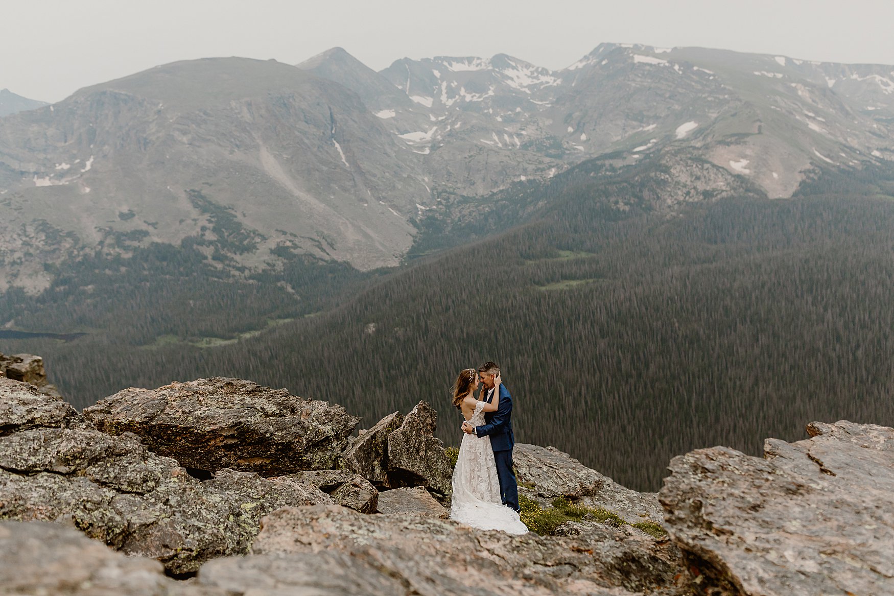 Couple takes photos with Lauren Casino Photography for their Rocky Mountain National Park elopement